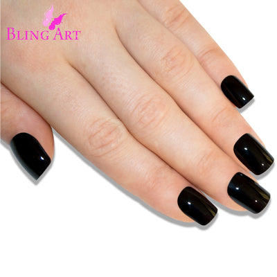 Deep jet black high-polish French manicure press-on false nails by Bling Art — modern edgy twist on the classic French look for evening wear and editorial styling · high-shine polished finish with black French tip · medium-length tips · 24 nails per set with adhesive · designed in Yorkshire