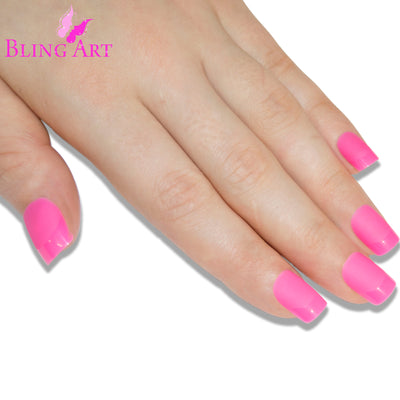 Pink matte French manicure Bling Art press-on nails — worn-hand close-up showing the blush-pink matte French tip on medium-length tips.