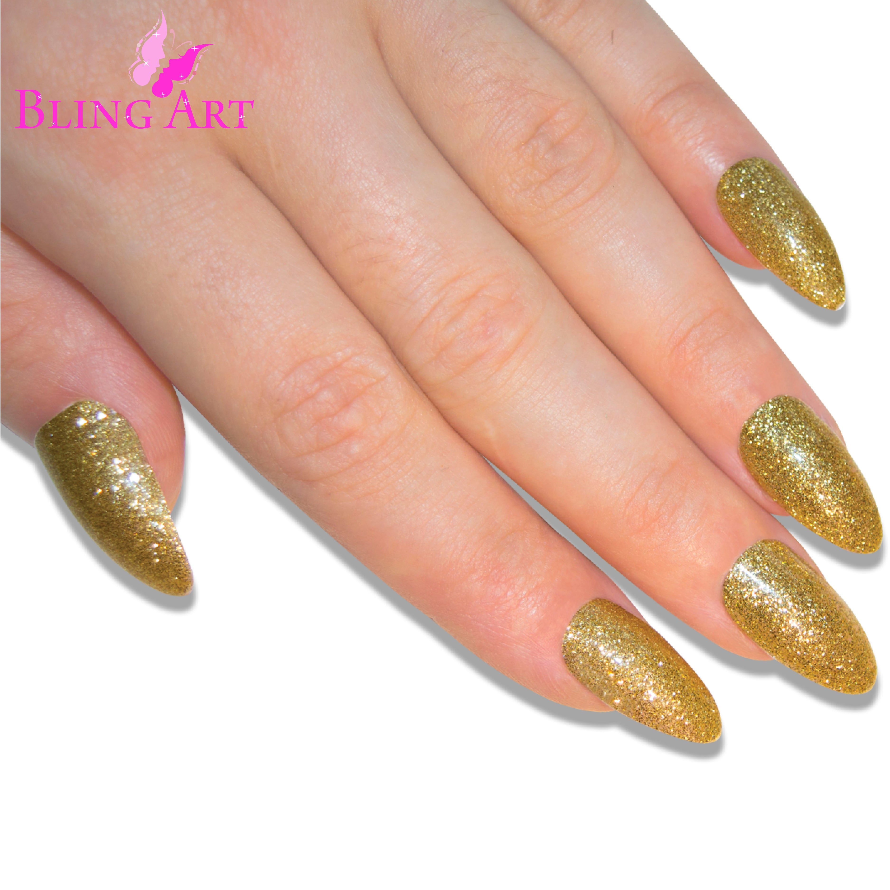 Gold gel almond stiletto Bling Art press-on nails — lifestyle context shot showing the celebration champagne-gold gloss.