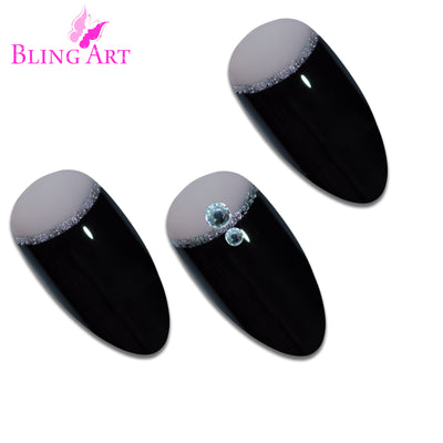 Black glitter almond stiletto Bling Art press-on nails — worn-hand close-up showing the crystal-cut black glitter on long pointed almond stiletto tips. Almond = Stiletto (same shape).