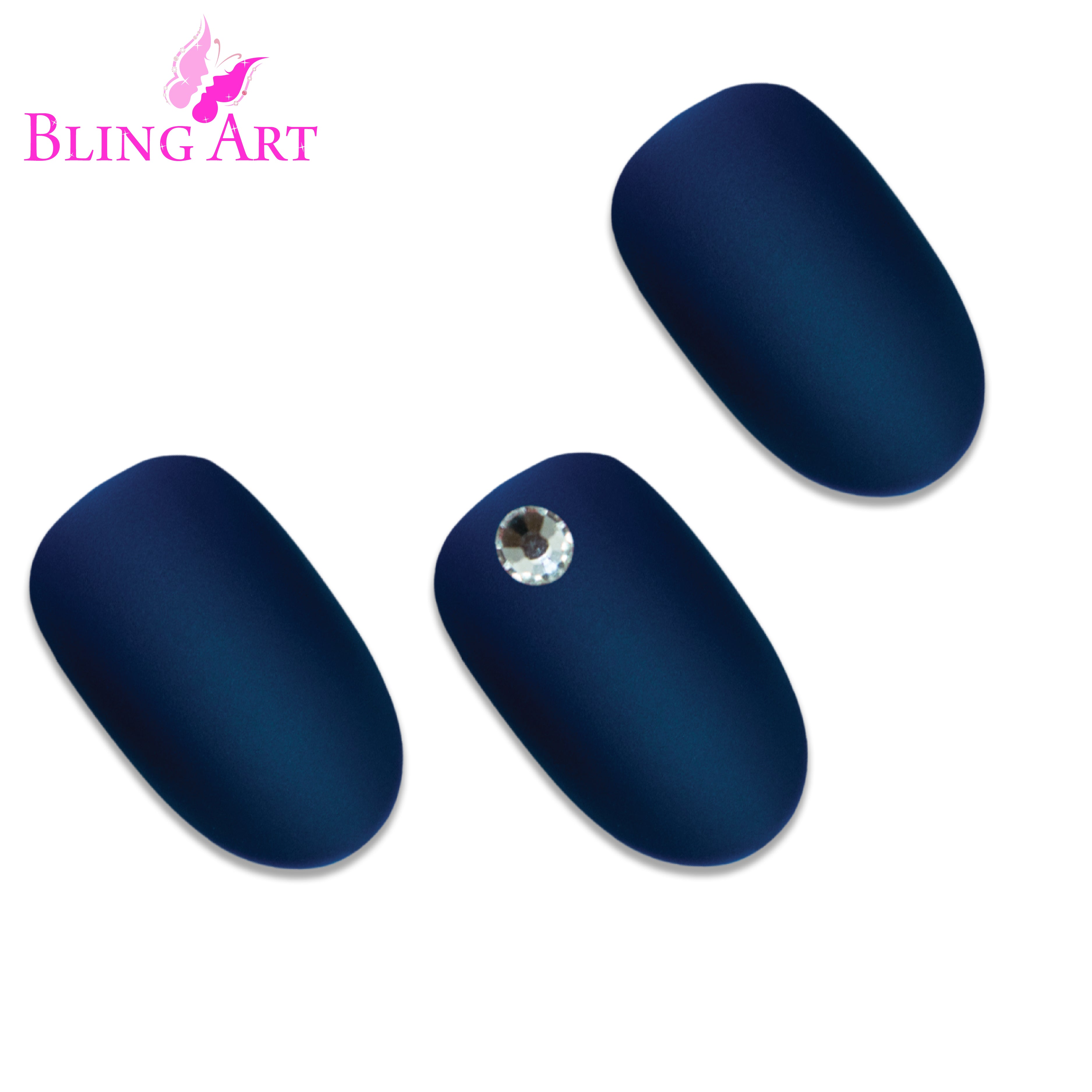 Blue matte oval press-on nails by Bling Art — worn-hand close-up showing the velvet ocean-blue matte texture on medium-length oval tips.