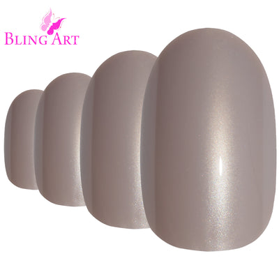Soft warm-beige glitter-finish oval-shaped press-on false nails by Bling Art — soft sparkle for weddings, romantic occasions, and elegant evenings · embedded fine glitter sparkle · medium-length oval tips · 24 nails per set with adhesive · designed in Yorkshire