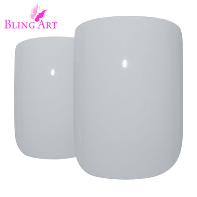 Crisp pearl white high-polish French squoval press-on false nails by Bling Art — bridal and minimalist elegance for weddings, office, and everyday wear · high-shine polished finish with French tip · medium-length squoval tips · 24 nails per set with adhesive · designed in Yorkshire