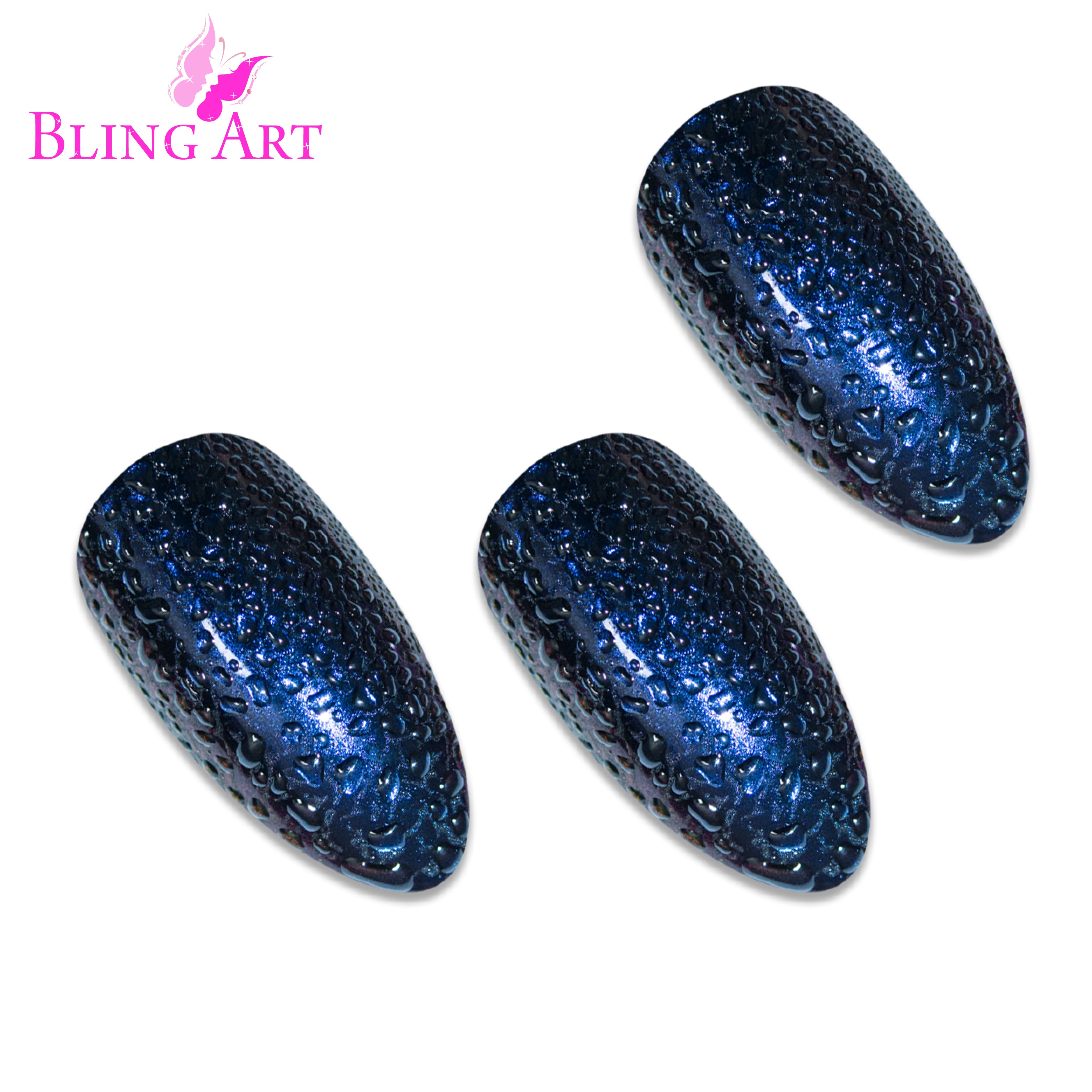 Blue Purple Water almond stiletto Bling Art press-on nails — worn-hand close-up showing the watercolour blue-to-purple effect on long pointed almond stiletto tips. Almond = Stiletto (same shape).