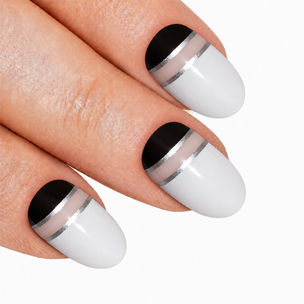 Black White glossy oval press-on false nails by Bling Art — two-tone jet-black and pearl-white high-shine on oval shape for parties and editorial styling. 24 nails, 12 sizes XS-XXL, no UV lamp. Designed in Yorkshire UK.