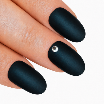 Black matte oval press-on false nails by Bling Art — deep jet-black velvet matte for edgy everyday wear and modern statement looks. 24 nails, 12 sizes XS-XXL, no UV lamp. Designed in Yorkshire UK.