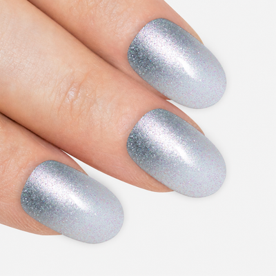 Silver gel ombre oval press-on false nails by Bling Art — chrome silver gradient gel ombre on the classic oval shape for parties, Christmas and editorial events. 24 nails, 12 sizes XS-XXL, no UV lamp. Designed in Yorkshire UK.