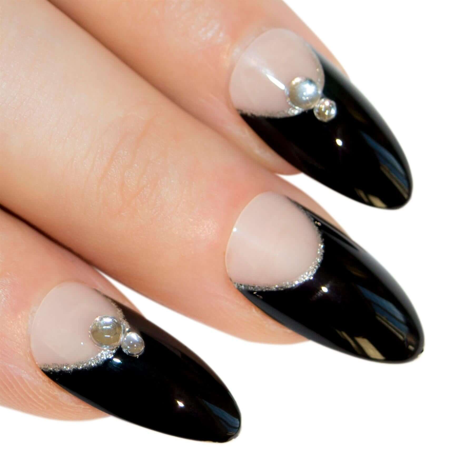 Black crystal-glitter almond stiletto long press-on false nails by Bling Art — bold sparkle statement for parties, New Year, and editorial events · embedded fine crystal-cut black glitter · long almond stiletto tips · 24 nails per set with adhesive · designed in Yorkshire