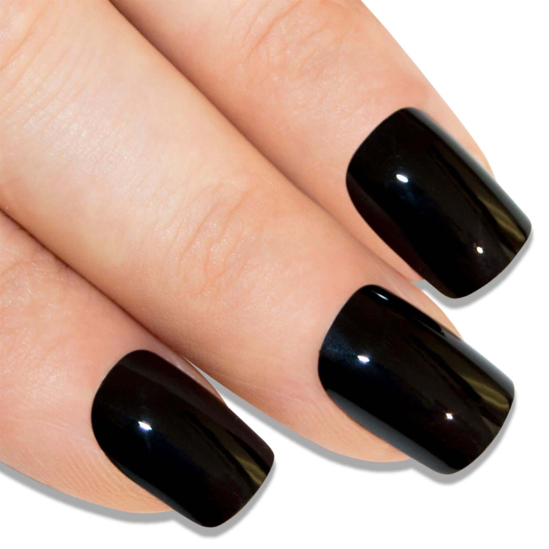 Deep jet black high-polish French manicure press-on false nails by Bling Art — modern edgy twist on the classic French look for evening wear and editorial styling · high-shine polished finish with black French tip · medium-length tips · 24 nails per set with adhesive · designed in Yorkshire