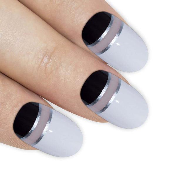 Two-tone jet black and pearl white glossy oval-shaped press-on false nails by Bling Art — high-contrast monochrome statement for parties, editorial events, and trend-led looks · high-shine glossy finish · medium-length oval tips · 24 nails per set with adhesive · designed in Yorkshire