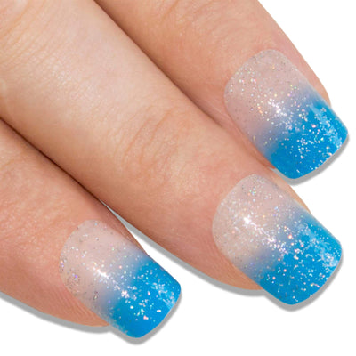 Sparkling blue French manicure press-on false nails by Bling Art — playful sparkle twist on the classic French for parties, summer events, and Valentine's Day · embedded blue glitter with French tip · medium-length tips · 24 nails per set with adhesive · designed in Yorkshire