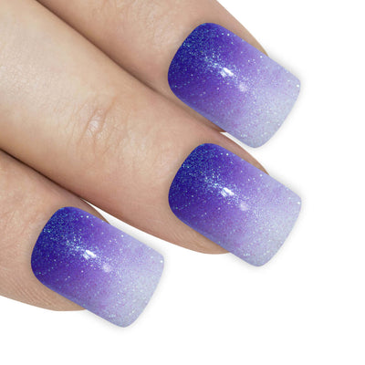 Purple gel ombre French squoval Bling Art press-on nails — worn-hand close-up showing the aubergine-to-white gradient French on squoval tips.