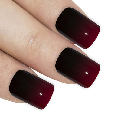 Crimson red and jet black French squoval press-on false nails by Bling Art — bold two-tone statement for date nights, parties, and editorial events · high-shine finish with red-and-black French tip · medium-length squoval tips · 24 nails per set with adhesive · designed in Yorkshire