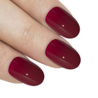 Bold crimson red high-polish oval-shaped press-on false nails by Bling Art — confident statement gloss for date nights, parties, and Valentine's Day · high-shine polished finish · medium-length oval tips · 24 nails per set with adhesive · designed in Yorkshire